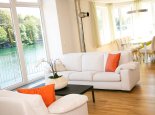 Galerie: Wohnzimmer im Appartement Wasserlilie – Seevilla Cattina – Appartements am Millstätter See in Kärnten